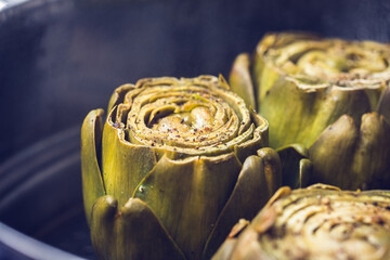 Steam cooked artichokes with salt and pepper.