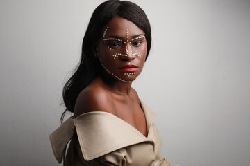 Portrait of beautiful African black woman with pearls on skin. Space for text.