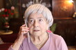 Preoccupied elder woman on the phone