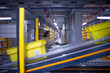 canvas print picture - interior of logistic warehouse with a worker walking