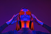 Neon Close Up Portrait Of Young Woman In Red Sunglasses. Studio Shot