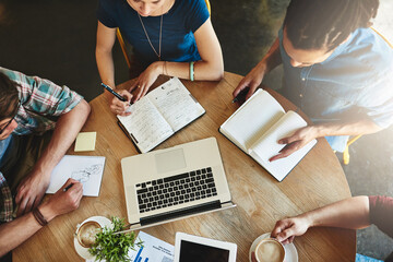 Poster - They fill in the gaps on my study notes. High angle shot of a group of students studying in a coffee shop.