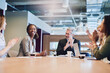 © Adene S/peopleimages.com - Great job. Low angle shot of a group of businesspeople applauding a colleague while sitting in the boardroom during a meeting.