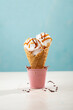 Ice cream scoops gelato in cone blue background