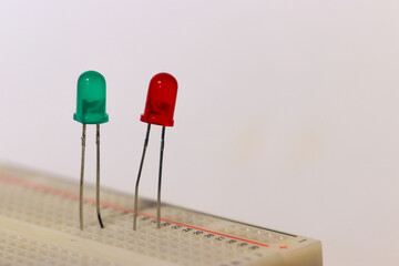 two green and red LEDs on a breadbord for electronic experiments 
