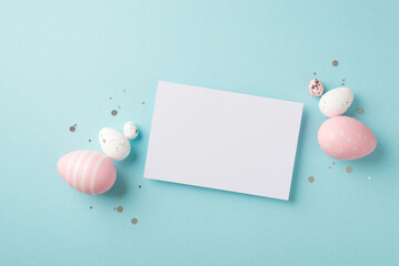 Wall Mural - Top view photo of easter decorations paper card sequins pink and white easter eggs on isolated pastel blue background with copyspace