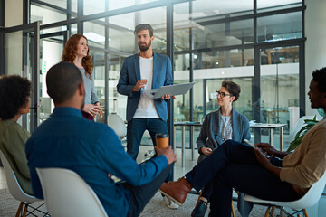 Aufkleber - Working towards maximising their potential as a team. Cropped shot of a group of creatives having a meeting in a modern office.
