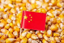 Flag Of China On Corn Grain. Fresh Harvested Corn With Flag Of China
