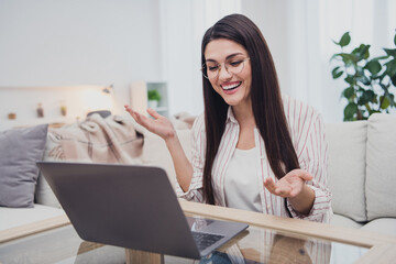 Sticker - Portrait of attractive cheerful smart clever long-haired woman using laptop calling web discussing project at home indoors