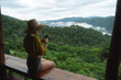 © mojo_cp - Happy traveller asian woman in nature with mountain in morning