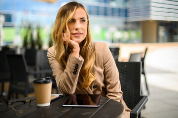 Young businesswoman on a coffee break, relaxing