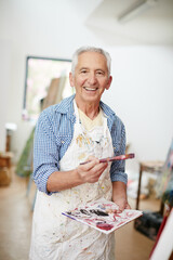 Canvas Print - Painting is my hobby. Shot of a senior man working on a painting at home.