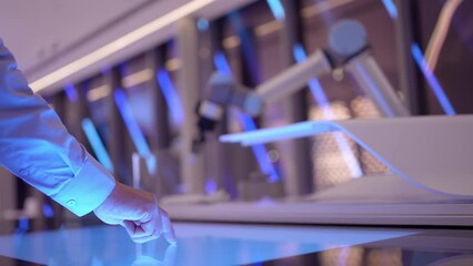 Industrial robotics engineer man using touch screen display, futuristic robot arm. artificial Intelligence digital high-tech technology modern equipment innovation, science medicine microchips concept