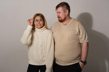 Man and woman on a gray background