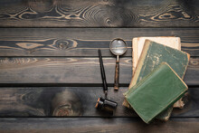 Stack Of Old Books, Quill Pen And Magnifying Glass On The Writer Table Flat Lay Background With Copy Space. Education.