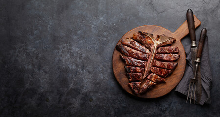 Wall Mural - Grilled porterhouse beef steak. Sliced T-bone