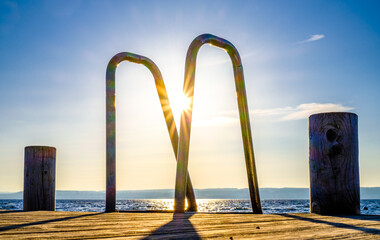 Wall Mural - old wooden jetty at a lake