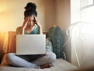 Wall Mural - Studying is too much. Full length shot of a young female student studying at home.