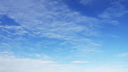 Wall Mural - wispy clouds and blue sky suitable for background