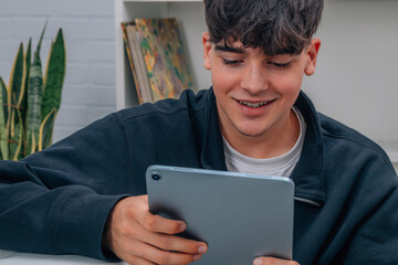 young teenager with digital tablet or e-book at home