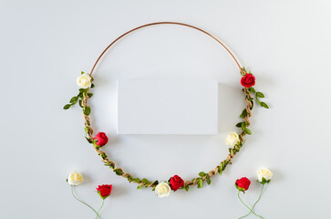 Wall Mural - Circle frame of flowers red en white roses with leaves on a white background