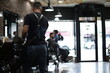 © Bainbridge - barber giving haircut in barbershop