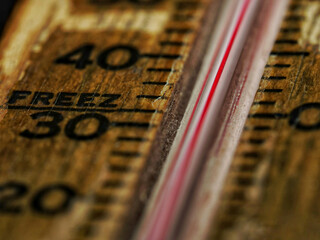 Wall Mural - A closeup of an old wooden thermometer