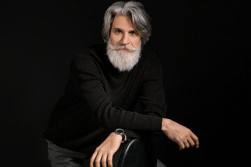 Poster - Portrait of handsome mature bearded man on dark background