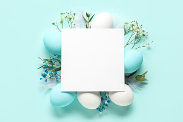 Composition with blank card, flowers and Easter eggs on color background