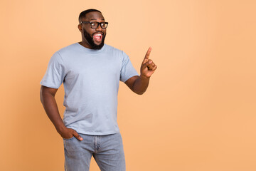 Wall Mural - Photo of celebrate millennial beard guy indicate promo wear eyewear blue outfit isolated on beige color background