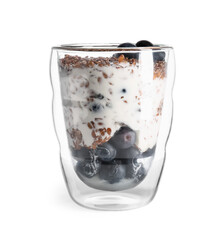 Glass with sweet yogurt, flax seeds and blueberries on white background