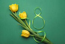 Figure 8 Made Of Ribbon And Flowers For International Women's Day Celebration On Green Background