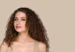© Utkamandarinka - Curly long brunette hair woman beauty portrait, female glamour face. Color backgound brown