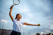 Portrait of happy fit young woman playing tennis. People sport healthy lifestyle concept