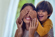 © Arnéll Koegelenberg/peopleimages.com - Playtime builds a healthy bond between children and their mothers. Shot of an adorable little boy playfully covering his mothers eyes at home.