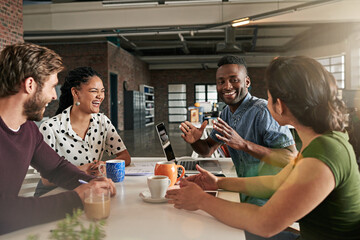 Wall Mural - Brainstorming makes for a great team building exercise. Shot of a team of colleagues having a meeting in a modern office.