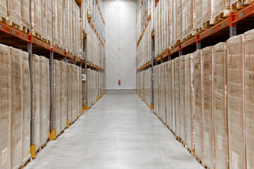 Wall Mural - logistic, storage, shipment and industry concept - cargo storing at warehouse shelves