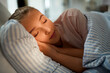 © Syda Productions - people, bedtime and rest concept - girl sleeping in bed at home