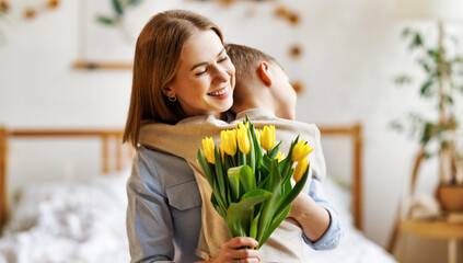 Poster - Grateful mother with bouquet hugging son