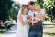 © Petro - Young couple with their baby daughter in park