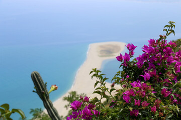 Wall Mural - High angle view of the sand tong of Punta Marinello nature reserve with horizon over the sea