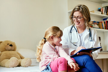 Wall Mural - Making the biggest difference to the littlest people. Shot of a doctor having a consultation with a little girl in her consulting room.