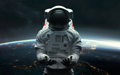 Wall Mural - Astronaut at the Earth orbit. 5K realistic science fiction art. Elements of image provided by Nasa