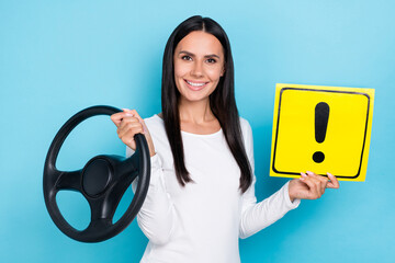 Poster - Photo of young woman hold paper symbol careful transport vehicle automobile isolated over blue color background