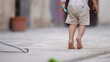 Child walking on tiptoes