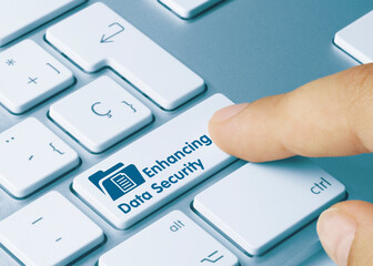 Enhancing Data Security  document - Inscription on Blue Keyboard Key.