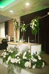 Wall Mural - The main table of the newlyweds for the wedding is decorated with whit