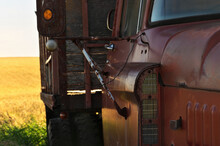 Abandoned Vintage And Rusty Truck In A Field On A Sunny Day