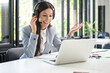 © Bojan - Young friendly operator woman customer service agent with phone VOIP headsets working in a call center