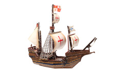 Children's Toy. Wooden Model Of A Sailing Ship Isolated On White Background.